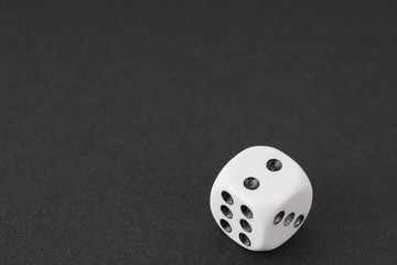 a dice over black surface