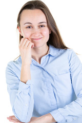 woman with fist on cheeks on blue shirt looks in camera