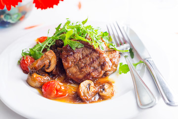 grilled beef steak and vegetables with wine and flowers on white background,
