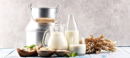 milk products. tasty healthy dairy products on a table. sour cream in a white bowl, cottage cheese...