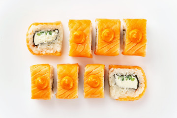 Closeup top view set of japanese philadelphia sushi rolls with salmon isolated at white background.
