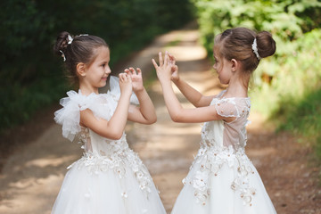 happy beautiful girls with white wedding dresses
