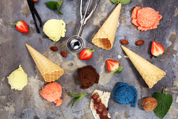 Set of ice cream scoops of different colors and flavours with berries and fruits