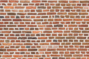 Full-frame red old brick wall horizontal image with old colorful stones