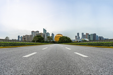 city road through modern buildings in hangzhou
