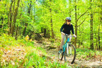 Naklejka premium Young Woman Riding Her Mountain Bike