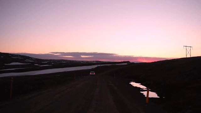 Can vanishing over a purple sunset in Iceland.