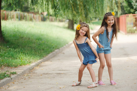 Photo Of Two Little Girls In Summer Park