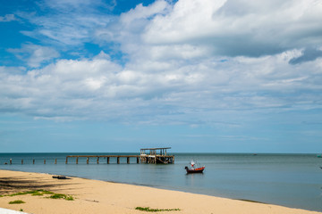 Pranburi beach with fishing boat 