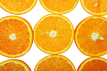 slices of fresh orange on white background. Closeup.