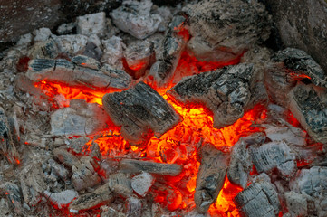 the dying fire, the red embers of a close-up top view