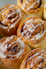 cinnamon rolls on wooden surface
