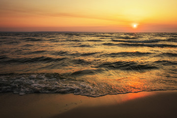 Fototapeta na wymiar Colorful ocean beach sunrise. Dawn over the sea. Nature composition