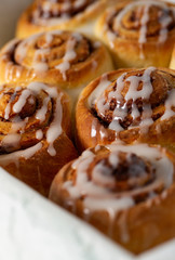 cinnamon rolls on wooden surface