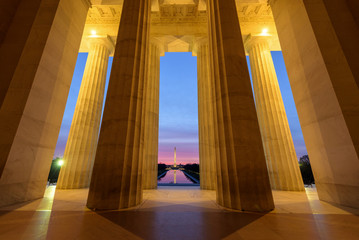 Wide angle view of Washington Monument with its reflection  from Lincoln Memorial at Sunrise,...