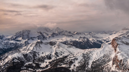 Stormy clouds in italian dolomites in a snowy winter