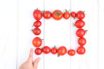 Fresh tomatoes on white backgrjund