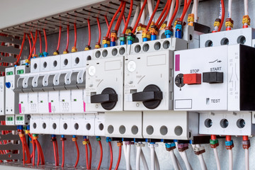 The electrical control panel are circuit breakers protecting the motor and relay. Circuit breakers with rotary handles and push-button and arranged in a row. Wires with ferrules number coded.