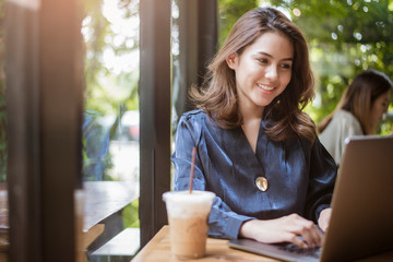 Smart business woman is working with computer