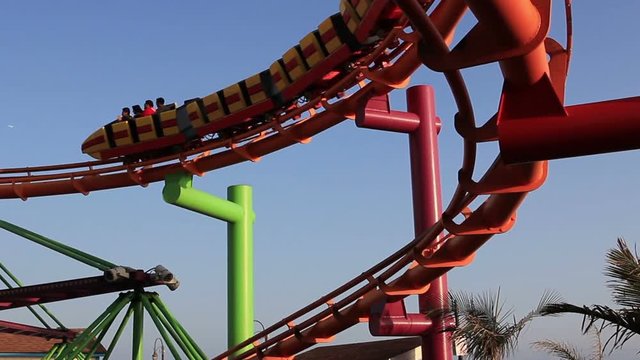 Roller coaster seen from below in a sunny summer afternoon