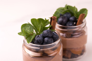 Cake dessert. Chocolate mousse with blueberry, mint and cinnamon