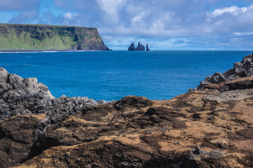 Fototapeta na wymiar Reynisdrangar seastacks seen from Dyrholaey foreland located on the south coast of Iceland