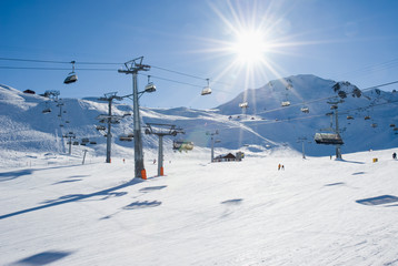 Many ski lifts crossing ski slope. Samnaun, Austria