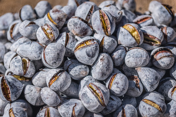 Chestnuts for sale on a stand at Rua Augusta street in Lisbon, Portugal