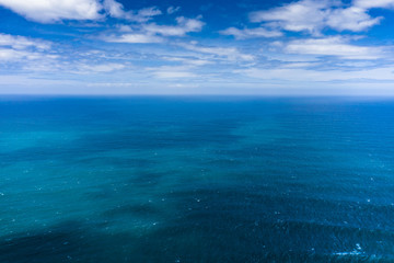 Aerial view to ocean waves. Blue water background. Photo made from above by drone.