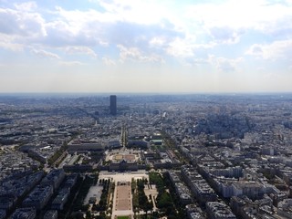 Obraz premium Champ de Mars view from top of eiffel tower looking down see the entire city as a beautiful classic architecture. A romantic place for lovers and family to visit.