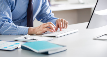 Close-up of hands senior businessman working with computer