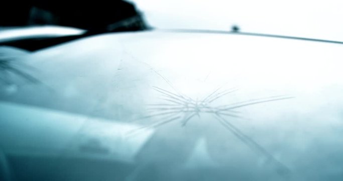 Large chipped and smashed windscreen on modern car