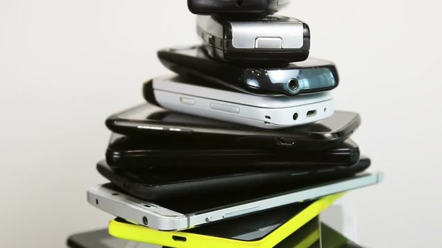 old, broken and scratched smartphones and mobile phones. video rotation
