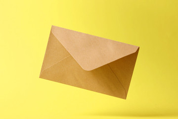 The envelope falls to the ground on a colored background.