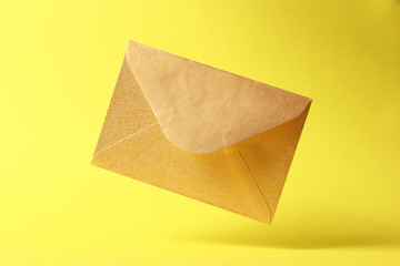 The envelope falls to the ground on a colored background.
