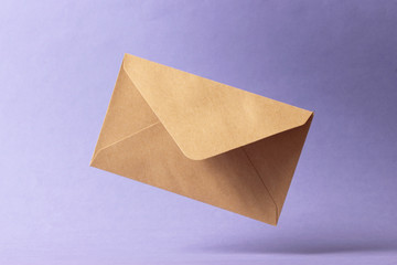 The envelope falls to the ground on a colored background.