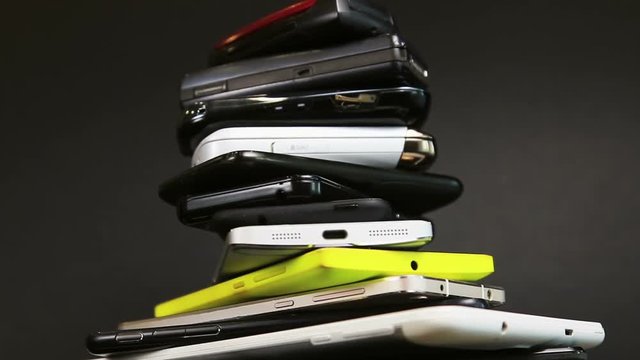old, broken and scratched smartphones and mobile phones. video rotation
