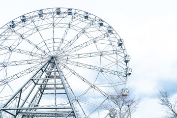 ferris or observation wheel over a blue sky