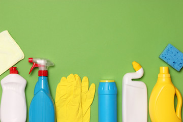  cleaning products on a colored background top view.