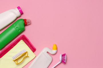 cleaning products on a colored background top view.