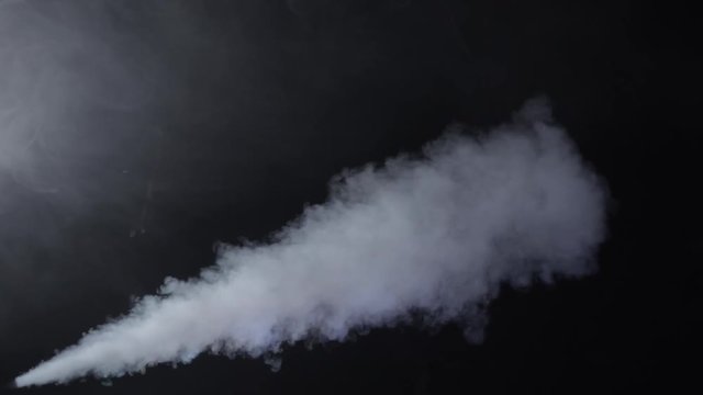 Smoke steam on black background in slow motion.
