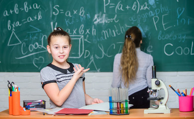 Educational experiment. Formal education school. Back to school. School classes. Girls study chemistry in school. Microscope test tubes chemical reactions. Pupils at chalkboard. Fascinating science