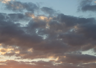 Naklejka na ściany i meble Beautiful sunset in the clouds, bright sun