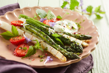 grilled tender asparagus shoots with strawberries