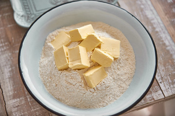 Flour and butter in a bowl to prepare the dough. cheese cake