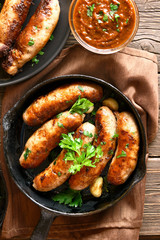 Grilled sausages in frying pan