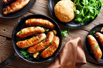 Fried sausages in frying pan