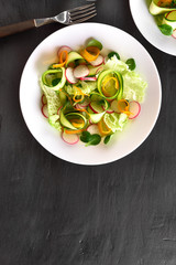 Vegetable salad from zucchini, radish, bell pepper