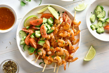 Prawns skewers with sauce