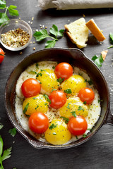Fried eggs with tomatoes